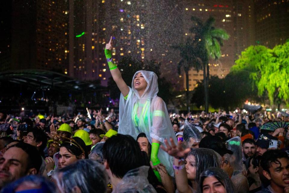 A woman reacts to the music as it rains Ultra 2024 at Bayfront Park in Downtown Miami on Friday, March 22, 2024.