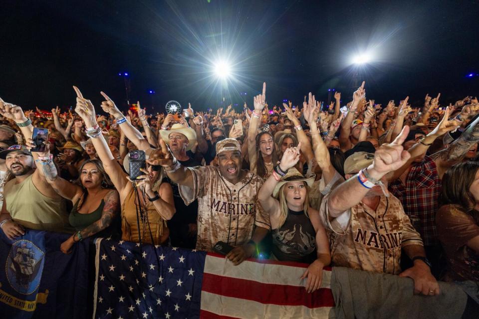 Fans cheer as Jelly Roll performs on the Mane Stage.