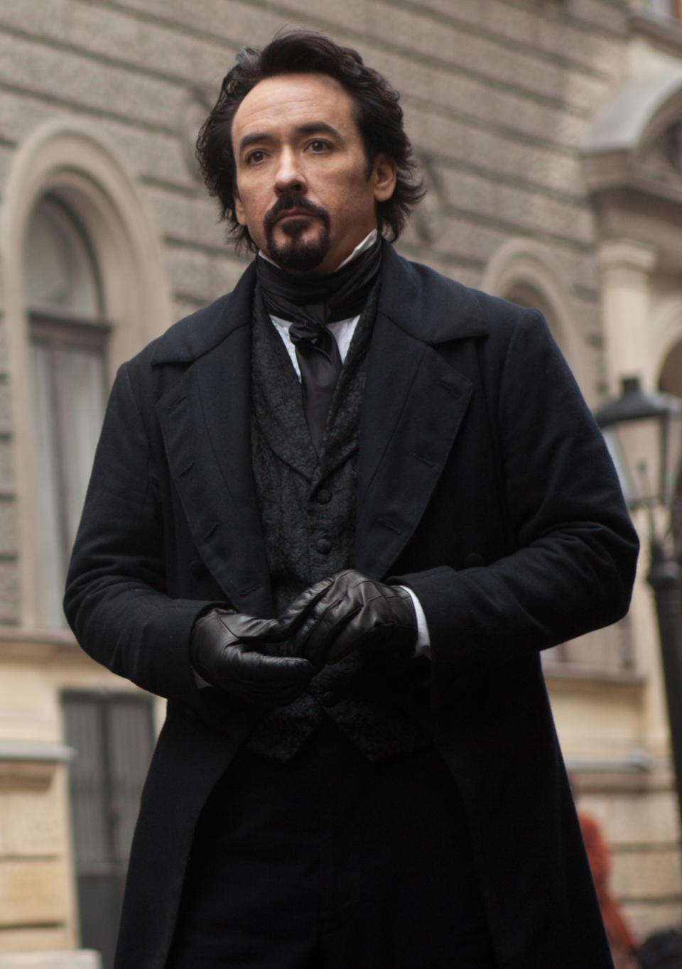 In this film publicity image released by Relativity Media, John Cusack portrays Edgar Allan Poe in a scene from the gothic thriller "The Raven." (AP Photo/Relativity Media, Larry Horricks)