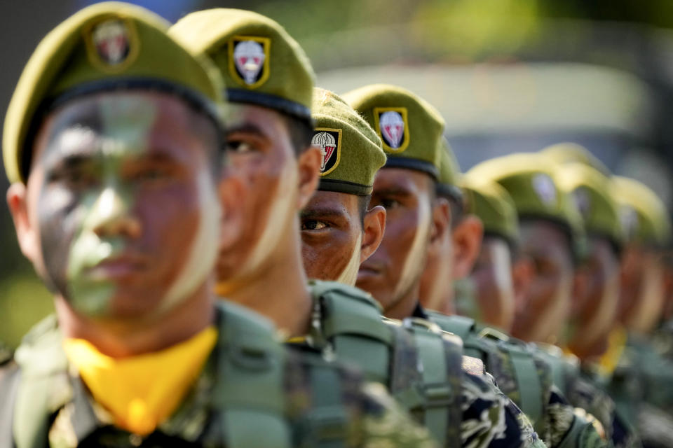 FILE- Filipino troopers stand during rites at the 126th founding anniversary of the Philippine Army at Fort Bonifacio in Taguig, Philippines on March 22, 2023. The Philippine defense chief has ordered all defense personnel and the 163,000-member military to refrain from using online tech tools that use artificial intelligence to generate personal portraits, saying they could pose security risks. (AP Photo/Aaron Favila, File)