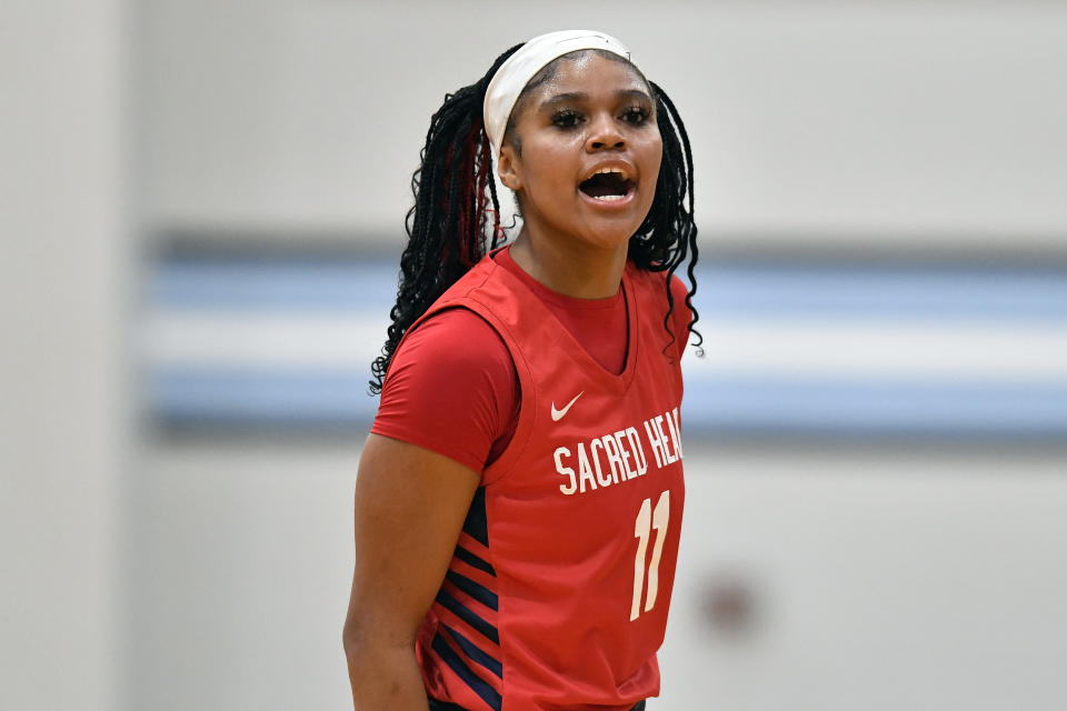 Sacred Heart Academy guard ZaKiyah Johnson shouts during a high school basketball game against Mercy Academy in Louisville, Ky., Sunday, Feb. 11, 2024. The junior wing ranked as a top prospect for next season has pared her initial list down to a dozen schools, a group that includes defending national champion LSU, current No. 1 and two-time champ South Carolina, UConn and nearby Louisville. (AP Photo/Timothy D. Easley)