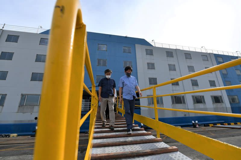 Singapore's Transport Minister Khaw Boon Wan is seen onboard a floating accommodation docked at Tanjong Pagar Terminal, meant to house healthy migrant workers, as the spread of the coronavirus disease (COVID-19) continues in Singapore