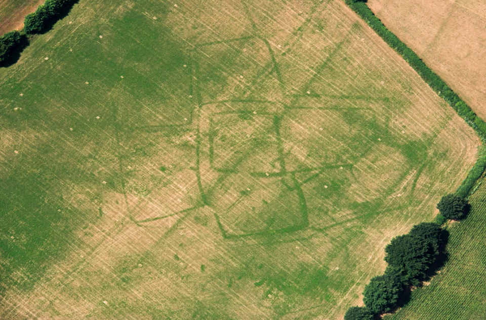 <p>A Roman farm in Bicton, Devon shows fields and paddocks surrounding a central enclosure (Historic England) </p>