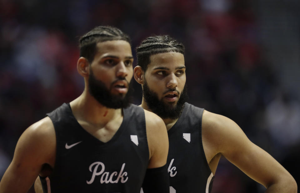 Nevada forward Cody Martin (11), right, and brother forward Caleb Martin (10) look on during the second half of an NCAA college basketball game against San Diego State Saturday, March 3, 2018, in San Diego. (AP Photo/Gregory Bull)