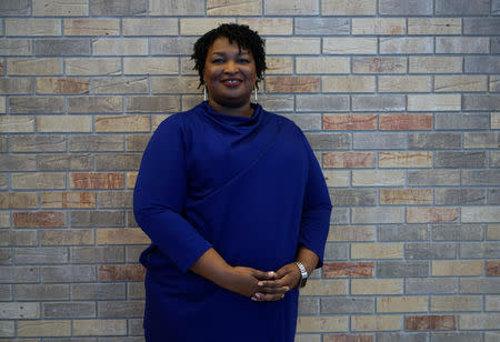 FILE PHOTO: Stacey Abrams, the Democratic gubernatorial candidate for Georgia, poses for a quick portrait before speaking to a crowd in Riverdale, Georgia, U.S., October 27, 2018 ahead of the midterm elections. REUTERS/Lawrence Bryant/File Photo