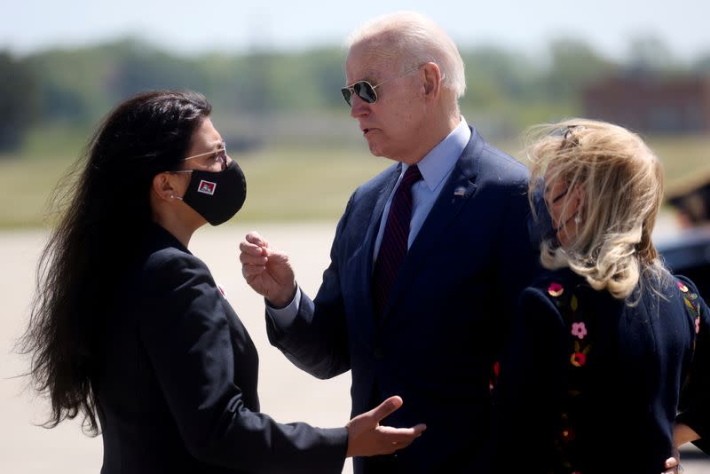 FILE PHOTO: U.S. President Joe Biden is greeted by U.S. Rep. Debbie Dingell (D-MI) and U.S. Rep. Rashida Tlaib at Detroit Metropolitan Wayne County Airport