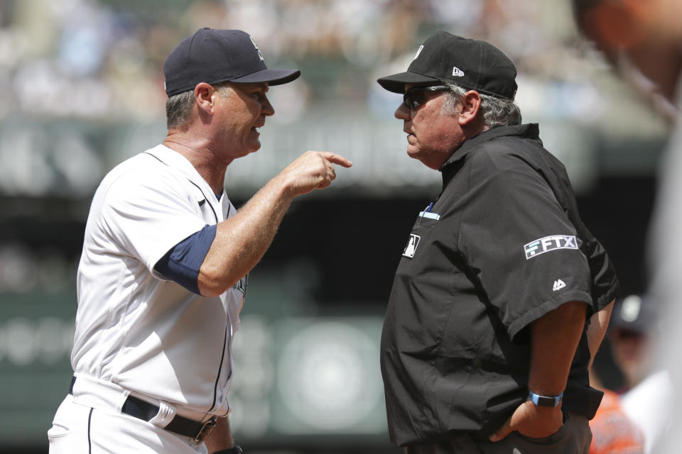 Seattle Mariners manager Scott Servais, left, argues with first base umpire Hunter Wendelstedt before being ejected in the fourth inning of a baseball game against the Houston Astros, Wednesday, July 28, 2021, in Seattle. (AP Photo/Jason Redmond)