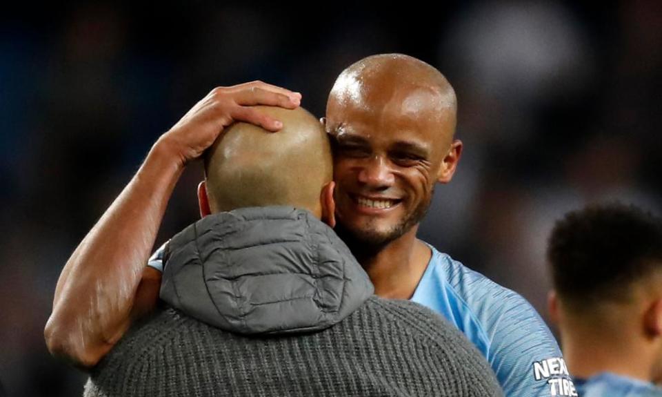 Pep Guardiola and Vincent Kompany embrace after the match.