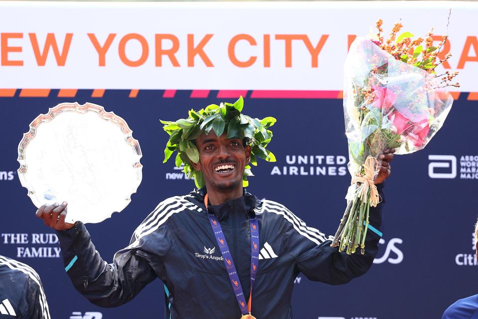 Ethiopia's Tamirat Tola celebrates his record-breaking victory in the New York City Marathon on Nov. 5, 2023 in Central Park in New York City.