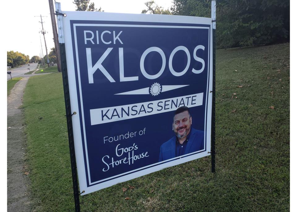 A 2020 campaign sign for Rick Kloos noted his position as founder of God's Storehouse in Topeka.