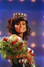 <p>1990 – CAROLE GIST – BEAUTY – First African-American Miss USA. — Miss Michigan Carole Gist, of Detroit, carries roses as she parades on stage after being crowned Miss USA 1990 in Wichita, Kans., March 2, 1990. (AP Photo/Cliff Schiappa) </p>