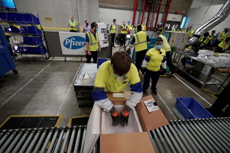 Boxes containing the Pfizer-BioNTech COVID-19 vaccine are prepared to be shipped at the Pfizer Global Supply Kalamazoo manufacturing plant in Portage, Michigan, U.S., December 13, 2020.  Morry Gash/Pool via REUTERS