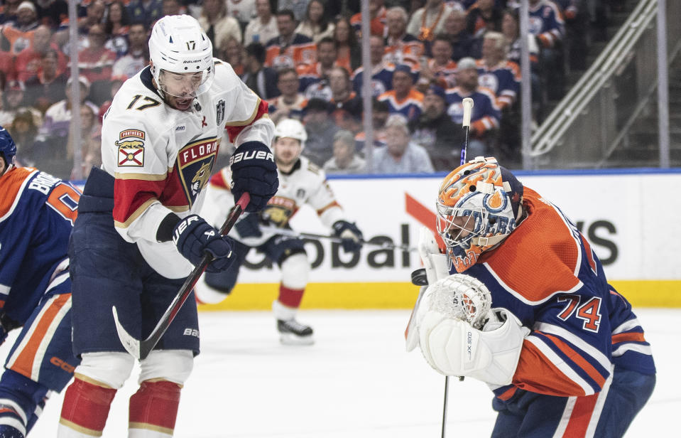 Florida Panthers' Evan Rodrigues (17) is stopped by Edmonton Oilers goalie Stuart Skinner (74) during the third period of Game 4 of the NHL hockey Stanley Cup Final, Saturday, June 15, 2024, in Edmonton, Alberta. (Jason Franson/The Canadian Press via AP)