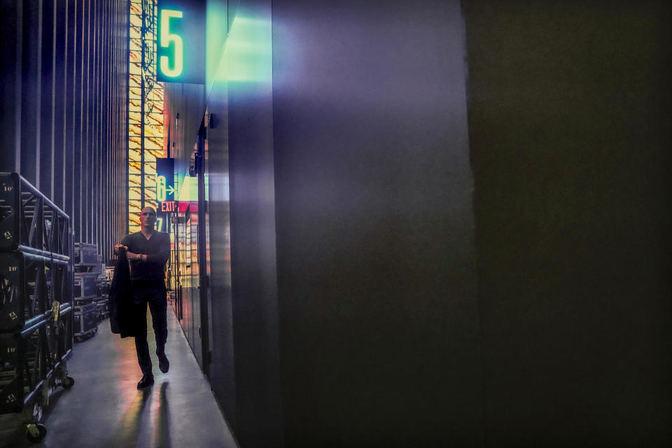 Joshua Ramus, architect of Perelman Performing Arts Center, a new theater complex on the grounds of the World Trade Center, walks the passageway between stages and panels of translucent marble wrapping the facility, Tuesday, Aug. 29, 2023, in New York. (AP Photo/Bebeto Matthews)