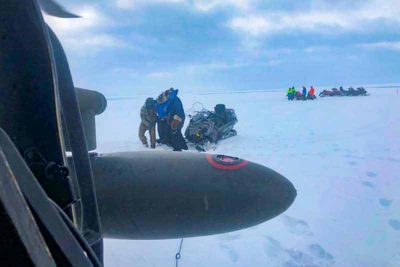 Three mushers from the Iditarod dog sled race are rescued by an aircrew of an Alaska Army National Guard near Nome