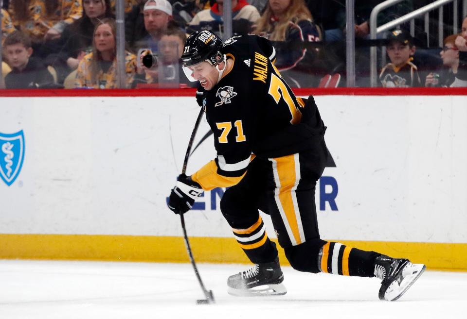 Mar 28, 2024; Pittsburgh, Pennsylvania, USA; Pittsburgh Penguins center Evgeni Malkin (71) shoots a slap shot against the Columbus Blue Jackets during the second period at PPG Paints Arena. Mandatory Credit: Charles LeClaire-USA TODAY Sports