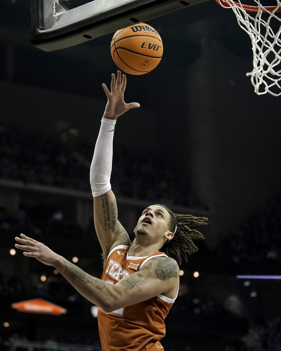 Texas forward Christian Bishop puts up a shot during the first half of the NCAA college basketball championship game against Kansas in the Big 12 Conference tournament Saturday, March 11, 2023, in Kansas City, Mo. (AP Photo/Charlie Riedel)