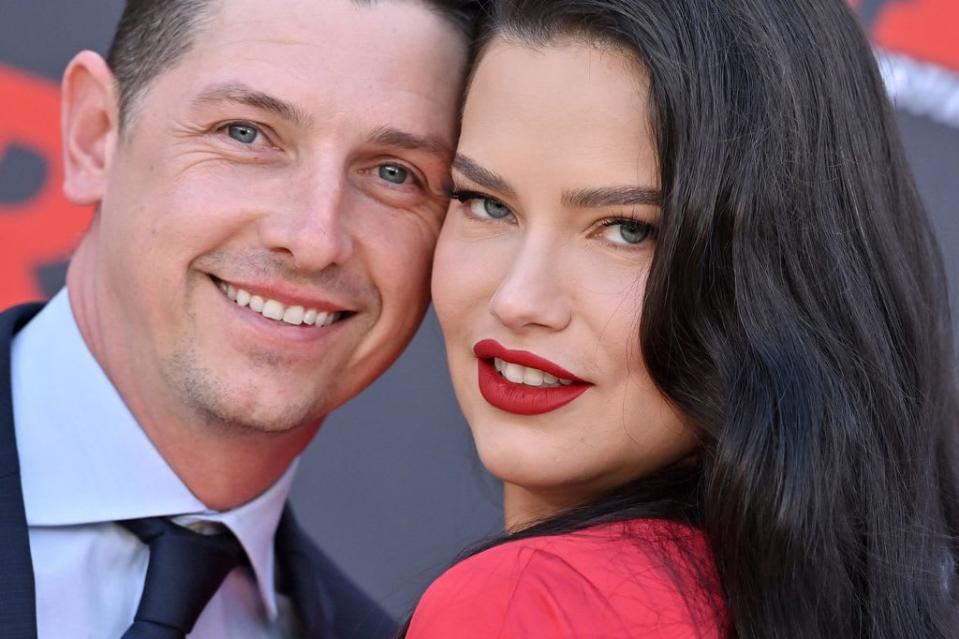 Adriana Lima with her boyfriend wearing red lipstick