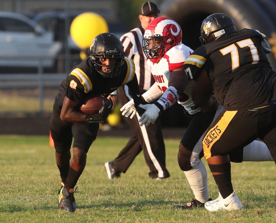 Central’s Cortez Stone breaks clear for a big run against Manual.Aug. 19, 2022