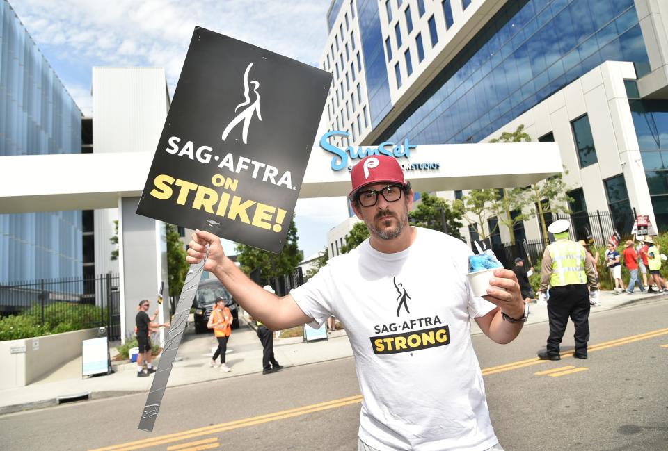 August 1, 2023: Adam Shapiro poses on a picket line outside Netflix studios, in Los Angeles. The actor's strike comes more than two months after screenwriters began striking in their bid to get better pay and working conditions.
