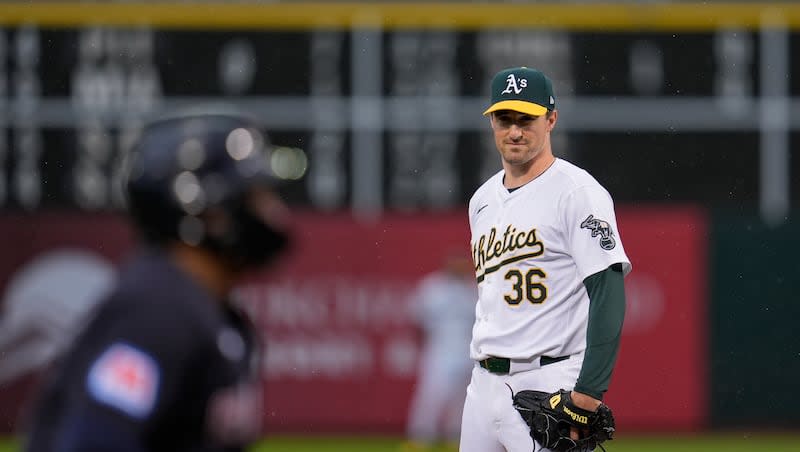 Oakland Athletics pitcher Ross Stripling (36) watches as Cleveland Guardians' Josh Naylor, foreground, scores on a balk during the first inning of a baseball game Friday, March 29, 2024, in Oakland, Calif.