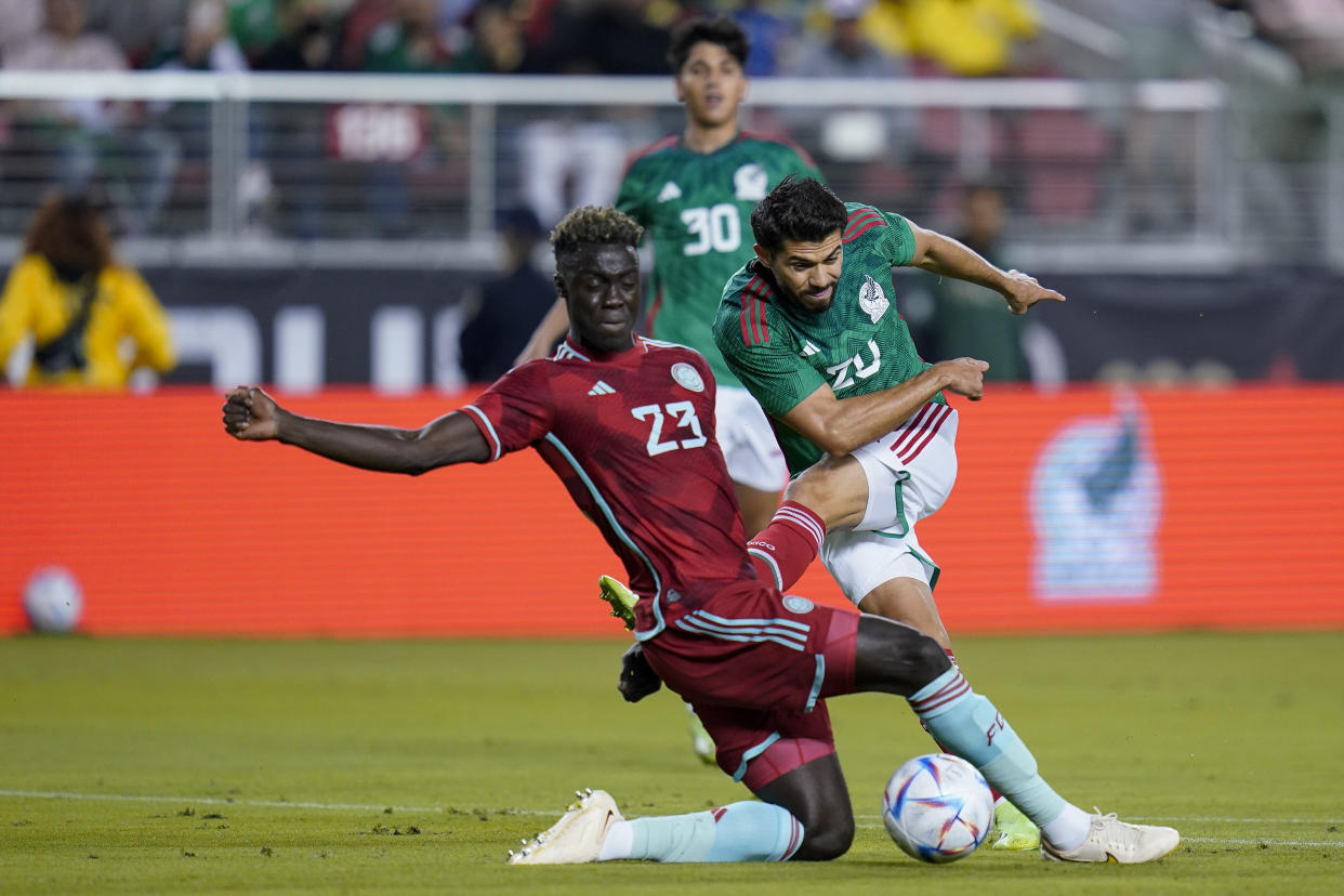 Colombia defender Davinson Sanchez (23) blocks a shot by Mexico forward Henry Martin (20) during the first half of an international friendly soccer match in Santa Clara, Calif., Tuesday, Sept. 27, 2022. (AP Photo/Godofredo A. Vásquez)