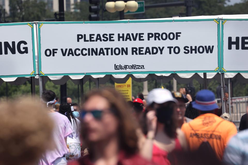 Guests are asked to show proof of having been vaccinated against the COVID-19 virus as they arrive for the first day of the Lollapalooza music festival on July 29, 2021 in Chicago, Illinois. The four-day music festival in the city's downtown is expected to draw 110,000 fans each day.