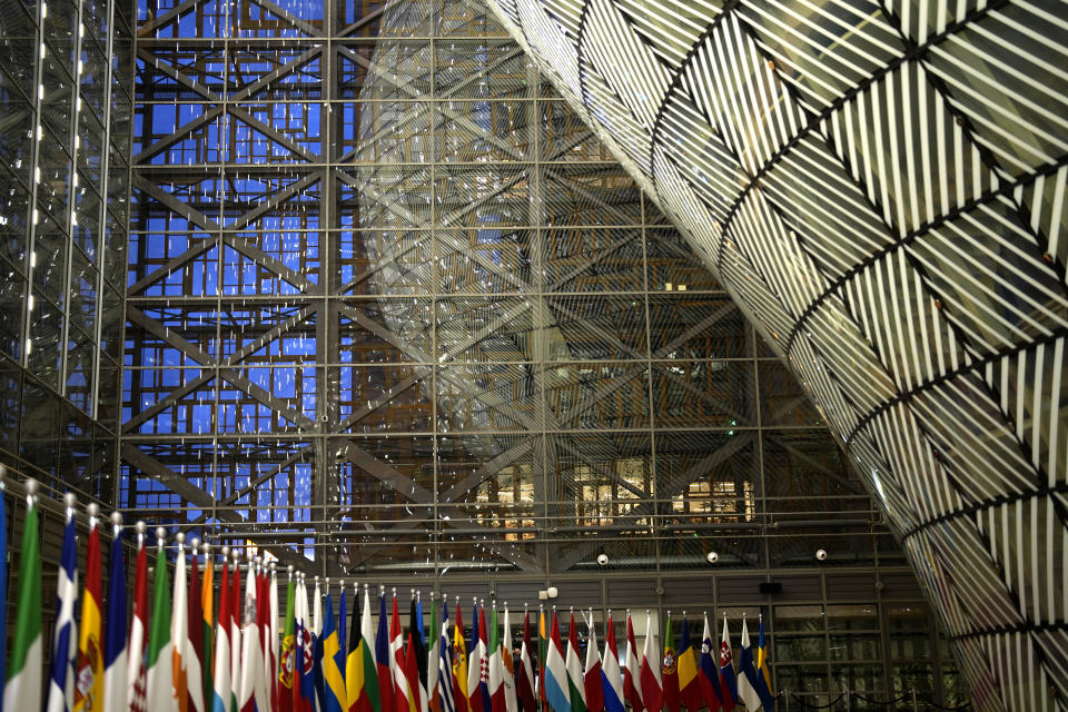 European Union flags line a red carpet at the arrival area during a meeting of EU foreign ministers at the European Council building in Brussels, Monday, Dec. 11, 2023. Pressure mounted on Hungary on Monday not to veto the opening of European Union membership talks and the supply of economic aid to war-torn Ukraine at a pivotal EU summit this week, after Prime Minister Viktor Orban demanded that the issue be struck from the agenda. (AP Photo/Virginia Mayo)