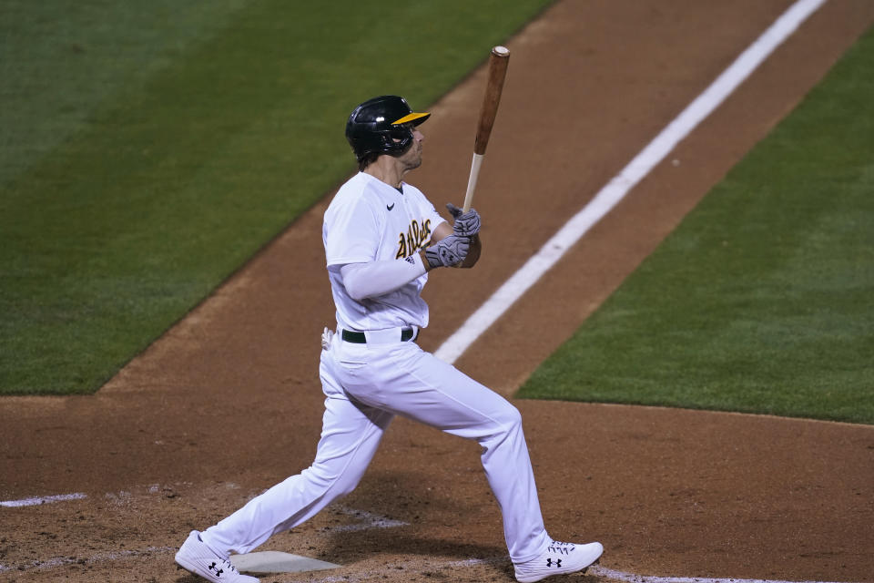 Oakland Athletics' Matt Olson watches his three-run home run off San Francisco Giants starting pitcher Logan Webb during the third inning of a baseball game Friday, Sept. 18, 2020, in Oakland, Calif. (AP Photo/Eric Risberg)