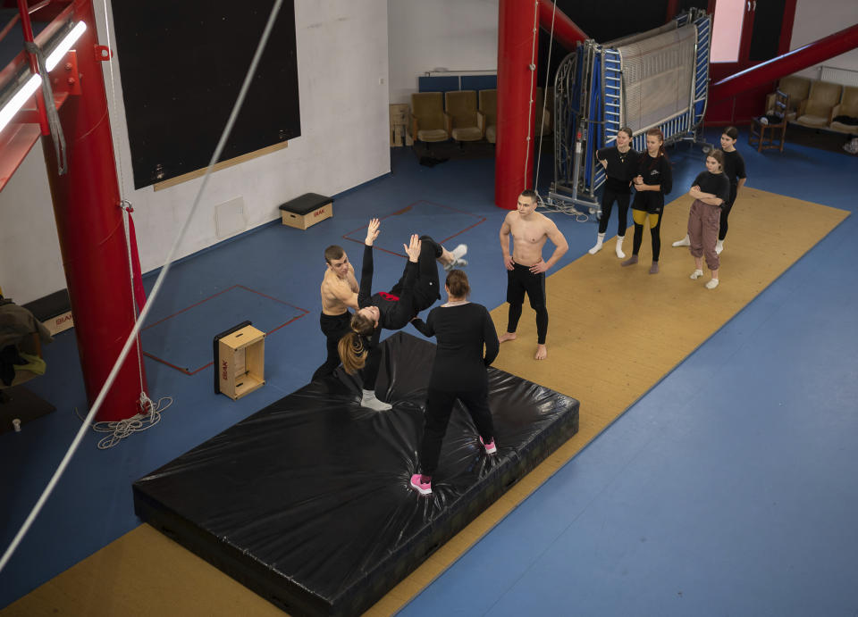 A group of young Ukrainian refugee circus students practicing in a training room in Budapest, Hungary, Monday, Feb. 13, 2023. More than 100 Ukrainian refugee circus students, between the ages of 5 and 20, found a home with the Capital Circus of Budapest after escaping the embattled cities of Kharkiv and Kyiv amid Russian bombings. (AP Photo/Denes Erdos)