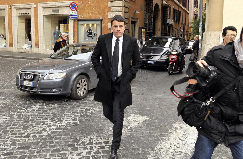 Democratic Party secretary Matteo Renzi arrives at Rome's Parliament house for talks with political party leaders in an effort to form a new coalition, Wednesday, Feb. 19, 2014. Italian President Giorgio Napolitano asked, Monday, Feb. 17, Renzi to try to form a new government after he managed to oust the previous premier Enrico Letta in a power grab. (AP Photo/Sub) ITALY OUT