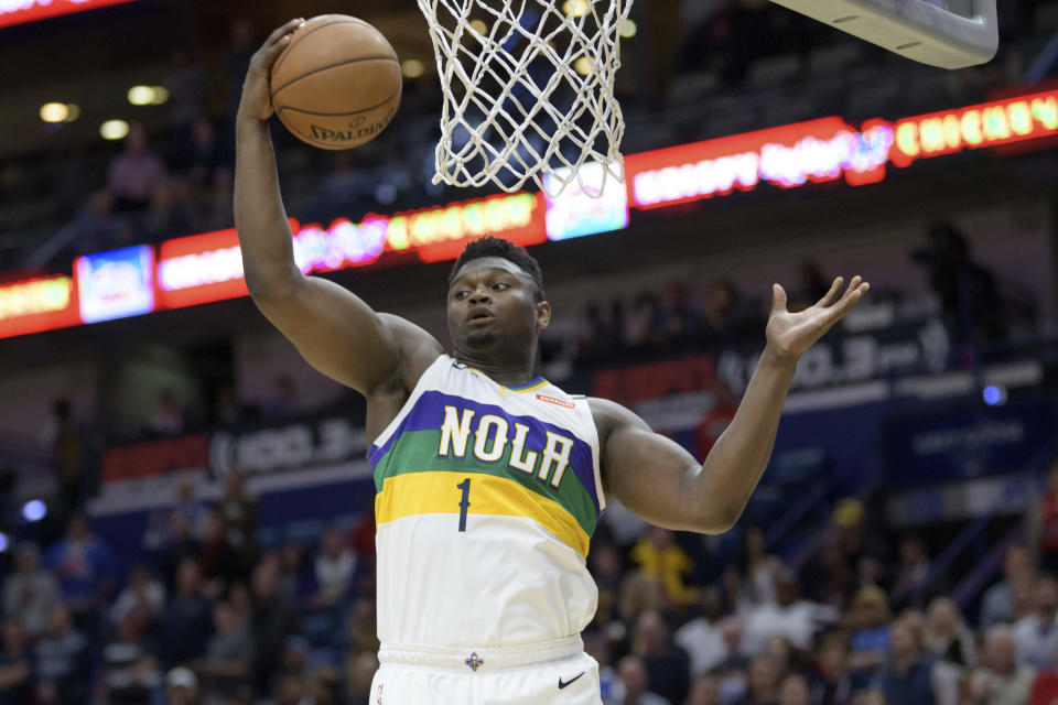 New Orleans Pelicans forward Zion Williamson grabs a rebound during the first half of the team's NBA basketball game against the Oklahoma City Thunder in New Orleans, Thursday, Feb. 13, 2020. (AP Photo/Matthew Hinton)