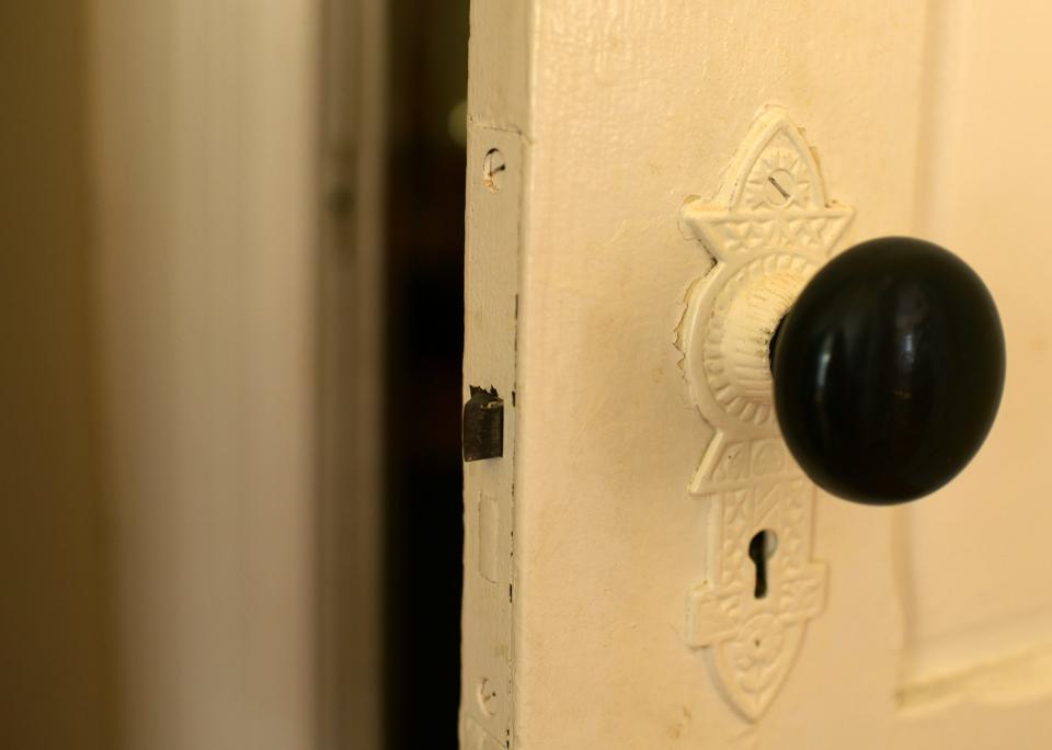 Original decorative detail of a keyhole door plate at 913 Main St., Worcester.