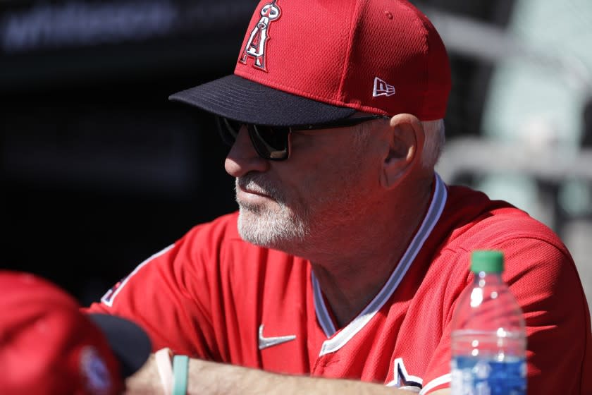 Los Angeles Angels manager Joe Maddon looks on before a spring training baseball game against the Los Angeles Dodgers, Wednesday, Feb. 26, 2020, in Glendale, Ariz. (AP Photo/Gregory Bull)
