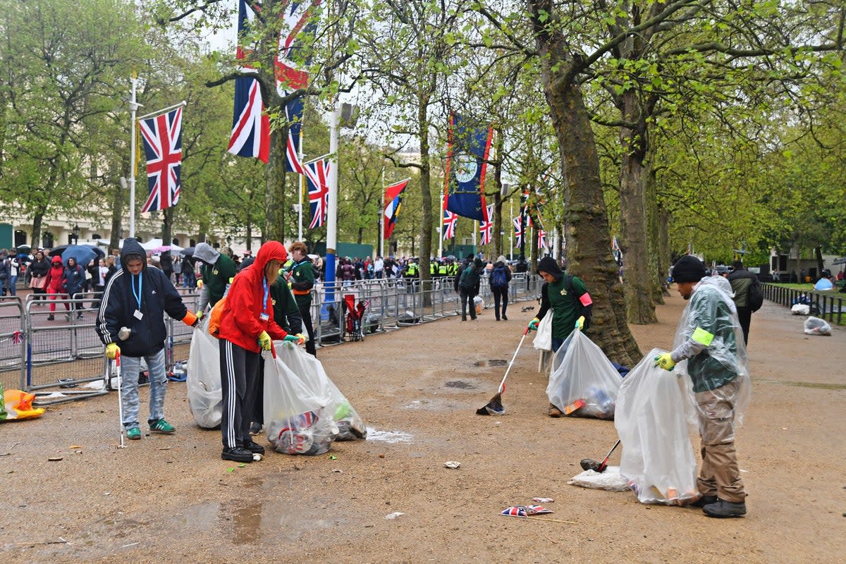 Litter pickers collect rubbish following the coronation day celebrations (Shutterstock)