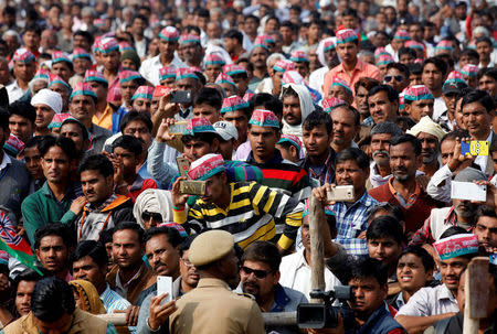 FILE PHOTO - People listen to a speech by Dimple Yadav (not in picture) wife of Samajwadi Party (SP) president and chief minister of the northern state of Uttar Pradesh Akhilesh Yadav, during an election campaign rally ahead of assembly polls, in Agra, India February 8, 2017. REUTERS/Pawan Kumar/File Photo