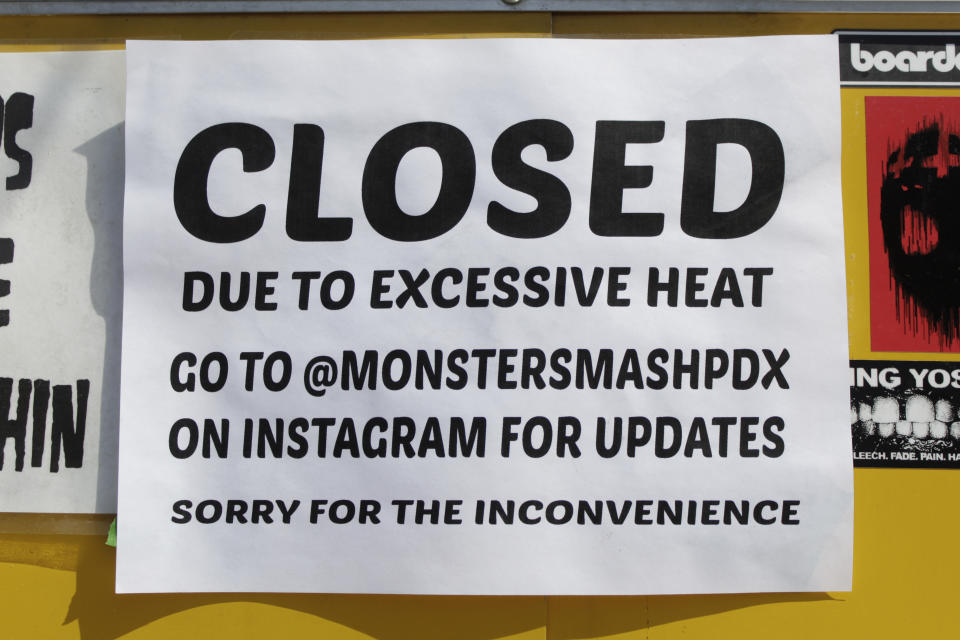 A closed sign is posted outside Rico Loverde's Monster Smash Burgers food cart in Portland, Ore., on Wednesday, July 27, 2022. (AP Photo/Gillian Flaccus)