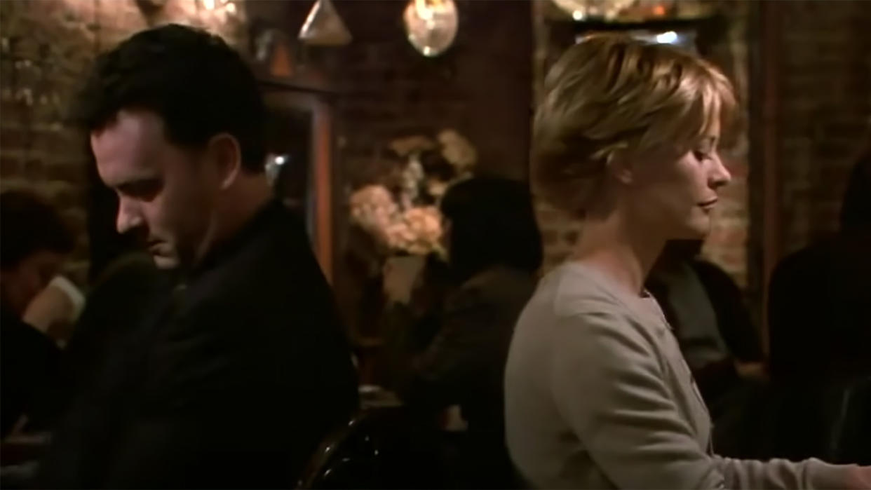  Tom Hanks and Meg Ryan ignore one another at dinner in You've Got Mail. 