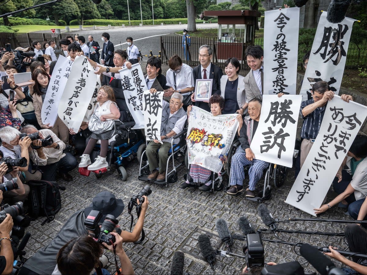 Some victims of the forced sterilisation programme outside the supreme court in Tokyo on 3 July 2024  (AFP via Getty)