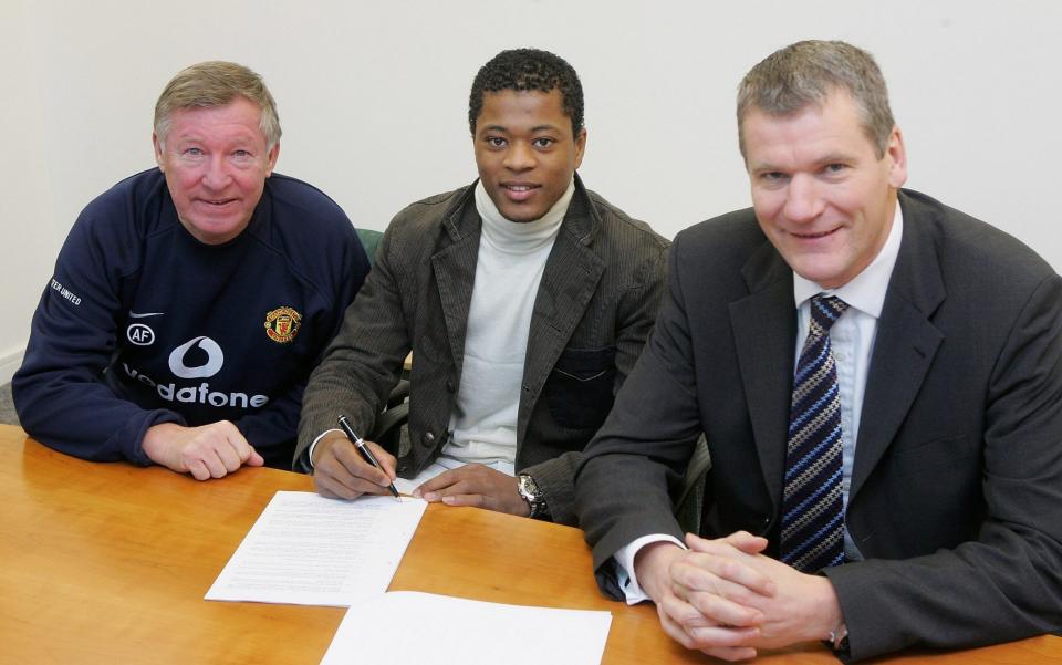 Sir Alex Ferguson (left) and David Gill (right) sign Patrice Evra (centre) for Manchester United - GETTY IMAGES