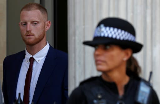 England cricketer Ben Stokes (L) leaves Bristol Crown Court on August 6