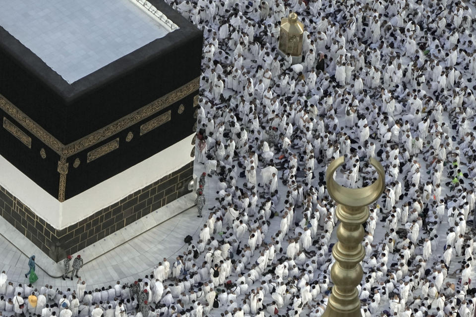 Muslim pilgrims pray in front of the Kaaba, the cubic building at the Grand Mosque, during the annual hajj pilgrimage, in Mecca, Saudi Arabia, Thursday, June 22, 2023. Muslim pilgrims are converging on Saudi Arabia's holy city of Mecca for the largest hajj since the coronavirus pandemic severely curtailed access to one of Islam's five pillars. (AP Photo/Amr Nabil)