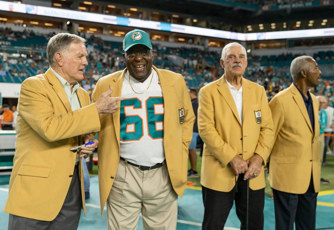 From left to right: Former Miami Dolphins quarterback Bob Griese, right guard Larry Little, fullback Larry Csonka and wide receiver Paul Warfield are seen on the field before the start of an NFL football game between the Miami Dolphins and the Pittsburgh Steelers at Hard Rock Stadium on Sunday, Oct. 23, 2022, in Miami Gardens, Fla.