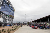 Fans watch the race on a jumbotron in the new garage and fan area during the Sugarlands Shine 250 at Talladega Superspeedway, Saturday, Oct 12, 2019, in Talladega, Ala. (AP Photo/Butch Dill)