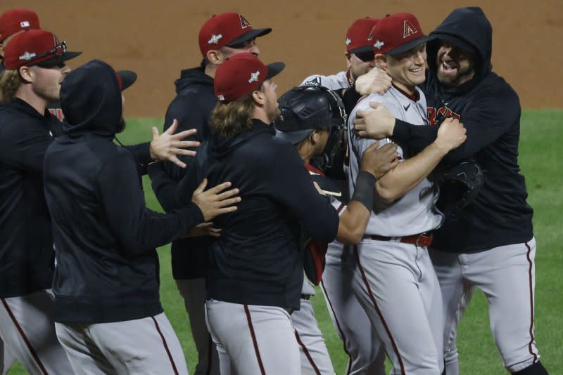 Pitcher Paul Sewald (R) is congratulated by teammates after the Arizona Diamondbacks defeated the Philadelphia Phillies in Game 7 of the National League Championship Series on Tuesday at Citizens Bank Park in Philadelphia. Photo by Laurence Kesterson/UPI