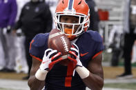 Illinois wide receiver Isaiah Williams catches a touchdown pass from Brandon Peters during the first half of an NCAA college football game against Northwestern Saturday, Nov. 27, 2021, in Champaign, Ill. (AP Photo/Charles Rex Arbogast)