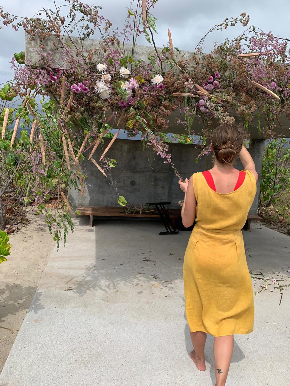 Taylor of Fox Fodder Farm, a friend who came to our wedding and also created our flower arrangements. Here she is creating the flower sculpture above the spot where we had our ceremony.