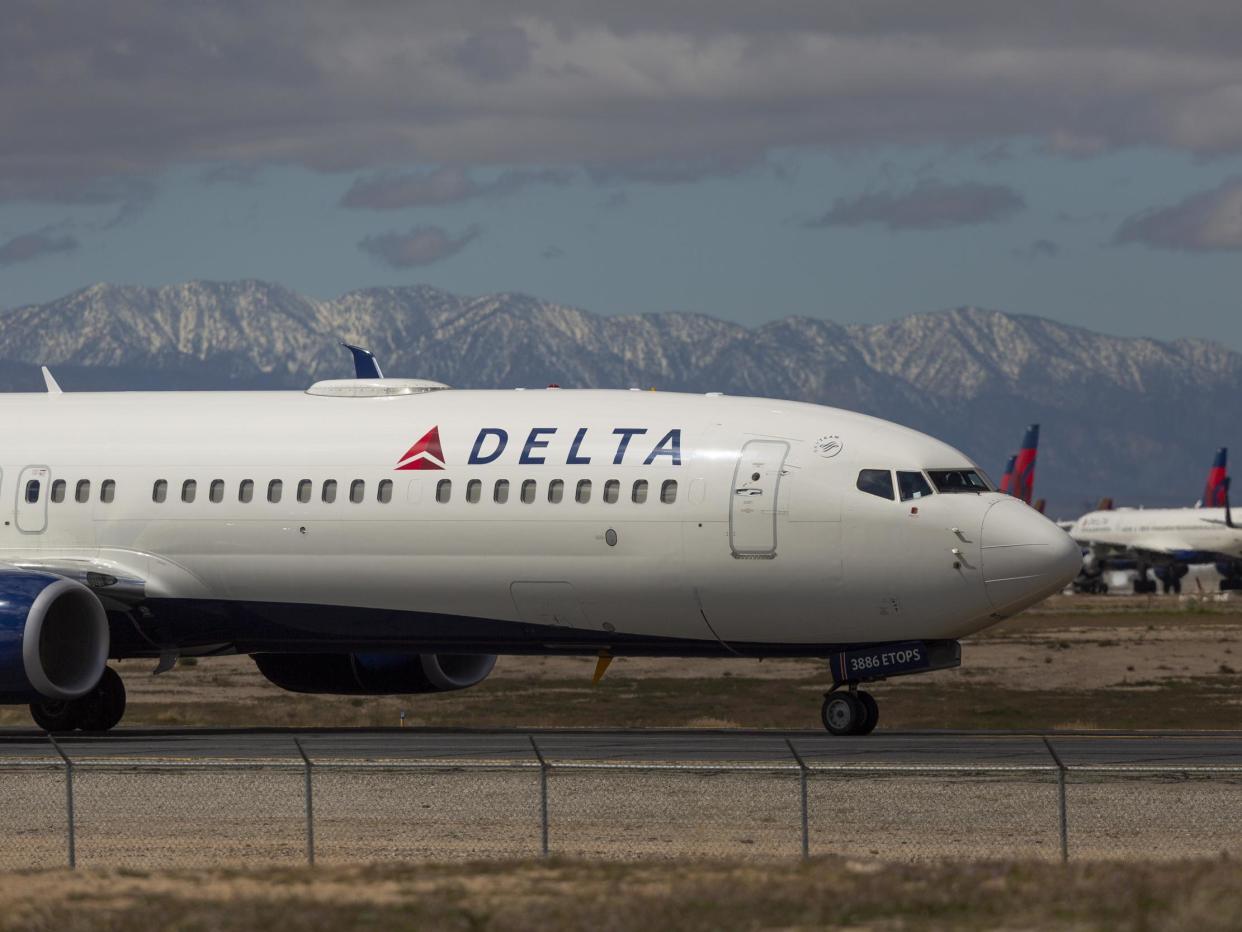 A Delta Air Lines jet taxis to be parked with a growing number of jets at Southern California Logistics Airport: (2020 Getty Images)