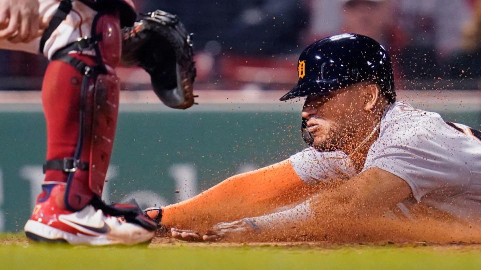 Detroit Tigers' Victor Reyes slides head first into home while scoring on an RBI double by Robbie Grossman during the fifth  at Fenway Park in Boston on Tuesday, May 4, 2021.