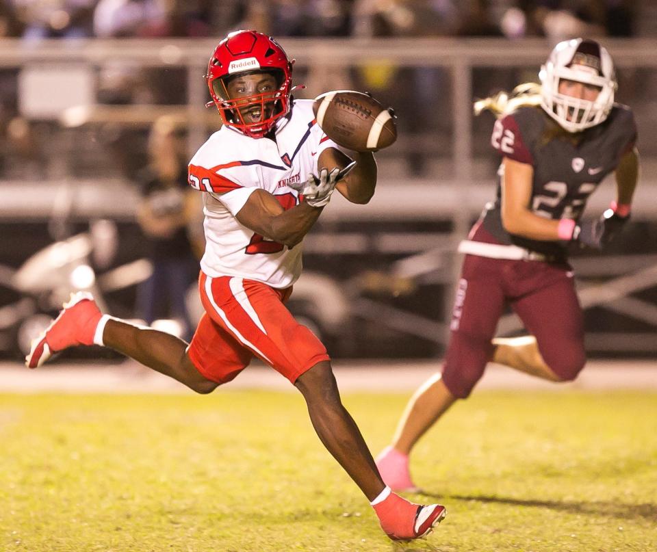 Vanguard Knights wide receiver Dallen Ponder (21) hauls in a pass for a touchdown in the first half. The North Marion Colts hosted the Vanguard Knights at North Marion High School in Citra, FL on Friday, October 6, 2023. [Doug Engle/Ocala Star Banner]